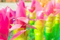 Recycled colorful plastic flowers made from plastic bottles to decorate as flowers in the garden.