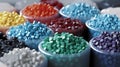 Recycled crushed plastic granules turned into new reused material. Plastic crossover. Recycled plastic with mixed colors