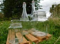 Recycled glass containers close-up in a meadow. zero waste