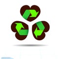 Recycled materials green symbol located on abstract three leaf clover leaf in shape of heart, an attribute to St. Patrick`s day. Royalty Free Stock Photo