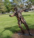 recycled metal art sculpture of a skater, boy, girl