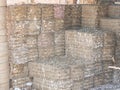 Recycled paper factory. Bales of cardboard, boxes and papers prepared to be recycled in a warehouse