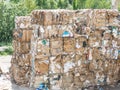Recycled paper factory. Bales of cardboard, boxes and papers prepared to be recycled in a warehouse