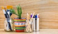 Recycled reused jars, tin and mug reused for different contents on wooden bench