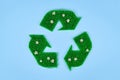 Recycling arrow symbol made from grass and flowers Royalty Free Stock Photo