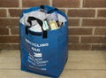 A recycling bag provided by the local council in Bangor Northern Ireland filled with waste collected over a few days in a local pe