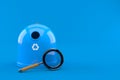 Recycling bin with magnifying glass Royalty Free Stock Photo