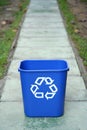 Recycling bin in the middle of a path Royalty Free Stock Photo