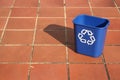 Recycling bin in the middle of a path Royalty Free Stock Photo