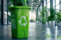 Green Recycling Bin in Modern Office Environment Royalty Free Stock Photo