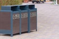 Recycling cans station on a walkway