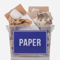 Recycling concept. Cardboard and recyclable paper in a container with the inscription paper isolated