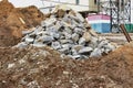 Recycling of concrete and building materials. A pile of concrete scrap at a construction site. Reuse of materials after