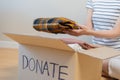 Recycling, Donation for poor, asian young woman, girl sitting pack on floor at home, holding donate box full with second hand