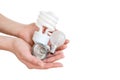 Recycling, electricity, environment and ecology concept - close up of hand holding energy saving lightbulbs or lamps on white back Royalty Free Stock Photo