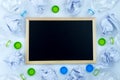 Recycling. The frame of used plastic bottle, blackboard and crumpled paper on white background with copy space. Recycle and reuse Royalty Free Stock Photo
