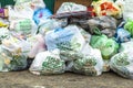 Recycling garbage concept. Plastic bags from supermarkets with garbage and food waste. Waste recycling concept