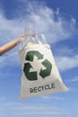 Recycling: hand holding bag with plastic bottles Royalty Free Stock Photo