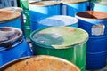 Recycling industry - Rusty metal barrels stacked in rows, toxic waste. Royalty Free Stock Photo