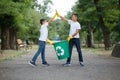 Group of kids volunteer help garbage collection charity environment, selective soft focus. Team work.