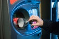 Recycling a plastic bottle in a recycling machine