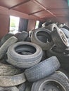 Recycling scrap tires from passenger cars in a container