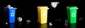 Recycling set bins. Yellow, green, blue dustbin for recycle plastic, paper and glass can trash isolated on black Royalty Free Stock Photo