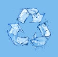 Recycling sign made of water splashes on blue background Royalty Free Stock Photo