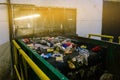 Recycling. Sorting garbage on a conveyor belt. The technological process at the waste recycling plant. Processing and