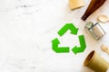 Recycling symbol and different garbage on marble background top view copyspace Royalty Free Stock Photo