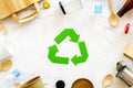 Recycling symbol and different garbage on marble background top view Royalty Free Stock Photo