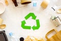Recycling symbol and different garbage on marble background top view Royalty Free Stock Photo