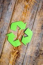 Recycling symbol in eco concept on wooden background top view mockup Royalty Free Stock Photo