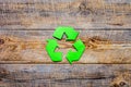 Recycling symbol in eco concept on wooden background top view mockup Royalty Free Stock Photo