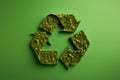 Recycling symbol made of green paper. Environmental protection, ecology, recycling concept