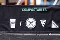 Recycling symbols on garbage bins compostables and recyclables