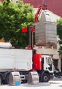 Recycling truck picking up garbage cans at city