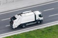 Recycling truck rides on the road in the city