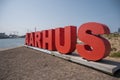 Red AARHUS Sign with big letters at the promenade near the port of Aarhus in Denmark Royalty Free Stock Photo