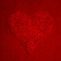 Red abstract heart on red background