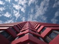 Red abstract skyscraper against blue sky Royalty Free Stock Photo