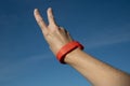 Red access bracelet with a chip. Contactless silicone key pass.