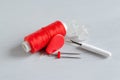 Red accessories for sewing on white background. Needlework and craft concept Royalty Free Stock Photo