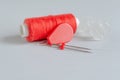 Red accessories for sewing on white background. Needlework and craft concept Royalty Free Stock Photo