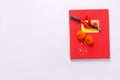 Red accounting note book , diya, and flower rangoli on white background Royalty Free Stock Photo