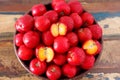 Red acerola (malpighia glabra), tropical fruit in busket