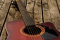 Beat up red acoustic guitar