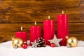 Red advent candles with balls and stars Royalty Free Stock Photo