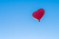 Red air in the form of a heart balloon in the blue sky Royalty Free Stock Photo