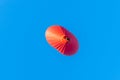 Red air in the form of a heart balloon in the blue sky Royalty Free Stock Photo